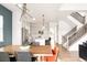 Open concept dining and kitchen area featuring a staircase and modern decor at 1925 W 165Th Way, Broomfield, CO 80023