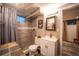 The updated basement bathroom has a shower and vanity with modern fixtures at 3125 Xenon St, Wheat Ridge, CO 80215