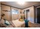 Bedroom features a sliding mirrored closet, neutral paint, and carpet flooring at 3125 Xenon St, Wheat Ridge, CO 80215
