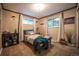 Bedroom with carpeting and neutral colors showcasing decor, two windows and furniture set up at 3125 Xenon St, Wheat Ridge, CO 80215