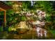 A stunning backyard water feature and lush garden landscaping create a tranquil outdoor retreat at 3125 Xenon St, Wheat Ridge, CO 80215