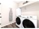 Laundry room with washer, dryer, and shelving at 521 Garden Sage Ct, Castle Rock, CO 80104