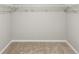An empty walk-in closet with wire shelving and neutral carpet, ready to be organized at 941 Sarah Ave, Fort Lupton, CO 80621