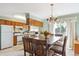 Charming dining area featuring a wooden table with seating for six, and large windows for natural light at 98 N Quicksilver Ave, Castle Rock, CO 80104