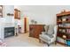 Comfortable living room with fireplace, built-in shelving, and a cozy armchair at 98 N Quicksilver Ave, Castle Rock, CO 80104