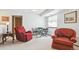 Cozy living room with neutral carpet, seating area, and table with chairs at 98 N Quicksilver Ave, Castle Rock, CO 80104