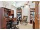 Cozy study with a large desk, comfortable rocking chair, and built-in bookshelves at 98 N Quicksilver Ave, Castle Rock, CO 80104