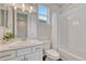 Well-lit bathroom featuring a vanity, sink, mirror and subway-tiled shower and tub combo at 2153 Abigail Ln, Castle Rock, CO 80104