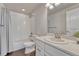 Clean bathroom with white subway tiles, a shower/tub combo, and a modern vanity at 2153 Abigail Ln, Castle Rock, CO 80104