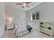 Bright bedroom featuring a modern style bed, ceiling fan, neutral colors and natural light at 2153 Abigail Ln, Castle Rock, CO 80104