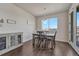 Charming dining area with rustic wood table, modern lighting, and natural light, perfect for Gathering meals at 2153 Abigail Ln, Castle Rock, CO 80104