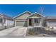 Charming home featuring a two-car garage, covered porch, and low maintenance landscaping at 2153 Abigail Ln, Castle Rock, CO 80104