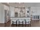 Modern kitchen with stainless steel appliances, large island, and stylish pendant lighting at 2153 Abigail Ln, Castle Rock, CO 80104