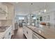 Open kitchen with large island, stainless steel appliances, and adjacent dining area at 2153 Abigail Ln, Castle Rock, CO 80104