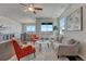 Spacious living area with comfortable seating, a cozy rug, and views of the outdoors, creating a relaxing ambiance at 2153 Abigail Ln, Castle Rock, CO 80104