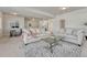 Open living room with plush sofas, and a dining area, perfect for relaxation and entertaining guests at 2153 Abigail Ln, Castle Rock, CO 80104
