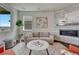 Inviting living room with stone fireplace, plush seating, and stylish decor creating a cozy and elegant atmosphere at 2153 Abigail Ln, Castle Rock, CO 80104