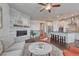 Open living area featuring a stone fireplace and connected modern kitchen at 2153 Abigail Ln, Castle Rock, CO 80104