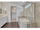 Luxurious bathroom featuring a soaking tub, glass-enclosed shower, and modern finishes, creating a spa-like atmosphere at 2153 Abigail Ln, Castle Rock, CO 80104