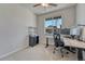 Office space featuring an adjustable desk, office chair, dual monitors and a large window at 2153 Abigail Ln, Castle Rock, CO 80104