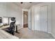 Office space featuring an adjustable desk and chair and a view to a closet at 2153 Abigail Ln, Castle Rock, CO 80104