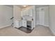 Stylish wet bar featuring white cabinets, a sink, and a wine cooler for easy entertaining at 2153 Abigail Ln, Castle Rock, CO 80104