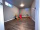 Finished basement playroom with toys and a slide at 187 Yates St, Denver, CO 80219