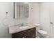 This bathroom has a marble sink vanity and a large wall mirror at 865 S Quebec St # 101B, Denver, CO 80247