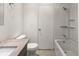 This bathroom features a shower and bathtub combo with tiled floors and a single sink vanity at 865 S Quebec St # 101B, Denver, CO 80247
