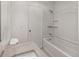 This bathroom has tiled floors, a combination shower-bathtub, and a single sink vanity at 865 S Quebec St # 101B, Denver, CO 80247