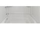 This bathtub has chrome faucets, a shower head, and white walls at 865 S Quebec St # 101B, Denver, CO 80247