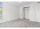 This bedroom features carpeted floors, a closet, and a bright window at 865 S Quebec St # 101B, Denver, CO 80247