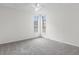 This is a bright bedroom featuring neutral-toned walls, carpeted floor, and a ceiling fan at 865 S Quebec St # 101B, Denver, CO 80247