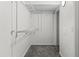 Walk-in closet with shelving and carpeted floor for optimal storage solutions at 865 S Quebec St # 101B, Denver, CO 80247