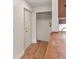 Welcoming entryway featuring a hall closet, coat hooks, and updated flooring at 865 S Quebec St # 101B, Denver, CO 80247