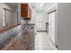 Kitchen featuring ample counter space, modern backsplash, and full size appliances at 865 S Quebec St # 101B, Denver, CO 80247