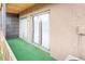 Patio with sliding glass doors offers easy access to outdoor space at 865 S Quebec St # 101B, Denver, CO 80247