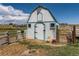 Charming barn with fenced enclosure, offering ample space and secure storage in a rural setting at 3550 E 160Th Ave, Thornton, CO 80602