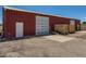 Large red barn with a sliding door and ample storage space in a rural setting at 3550 E 160Th Ave, Thornton, CO 80602