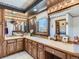Bathroom with double vanity, ample counter space, and decorative mirrors and fixtures at 3550 E 160Th Ave, Thornton, CO 80602