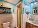 A charming bathroom featuring a tiled shower and a wooden vanity with a built-in sink at 3550 E 160Th Ave, Thornton, CO 80602