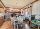 Inviting dining room features a fireplace, wood floors, and charming details, creating a warm atmosphere at 3550 E 160Th Ave, Thornton, CO 80602