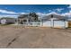 Exterior view of the property featuring a well-maintained house and detached two-car garage at 3550 E 160Th Ave, Thornton, CO 80602