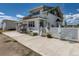 Charming two-story home with a welcoming front porch, swing, and beautifully landscaped surroundings at 3550 E 160Th Ave, Thornton, CO 80602