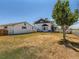 Spacious home with a large yard, detached garage, and mature trees, providing ample outdoor space at 3550 E 160Th Ave, Thornton, CO 80602