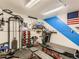 A home gym featuring a treadmill, weight bench, weights, and a cable machine at 3550 E 160Th Ave, Thornton, CO 80602