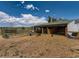 Horse shelter with a horse inside, providing shade and protection in a fenced enclosure at 3550 E 160Th Ave, Thornton, CO 80602