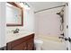 Bathroom featuring a sink with a wood vanity and a tub shower combination at 10890 Depew Pl, Broomfield, CO 80020
