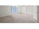 Bright bedroom features neutral carpet and sliding door closet at 10890 Depew Pl, Broomfield, CO 80020