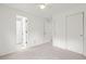 Bedroom with neutral carpet, a ceiling fan and two closets with sliding doors at 10890 Depew Pl, Broomfield, CO 80020